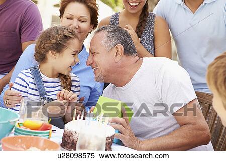 Multi Generation Family Celebrating Birthday In Garden View Large Photo Image Stock Photography - Multi Generation Family Celebrating Birthday In Garden. Fotosearch