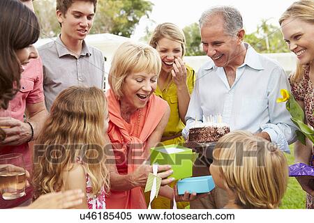 Multi Generation Family Celebrating Birthday In Garden View Large Photo Image Stock Photography - Multi Generation Family Celebrating Birthday In Garden. Fotosearch