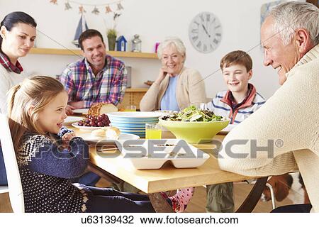 Multi Generation Family Eating Lunch At Kitchen Table View Large Photo Image Stock Image - Multi Generation Family Eating Lunch At Kitchen Table. Fotosearch