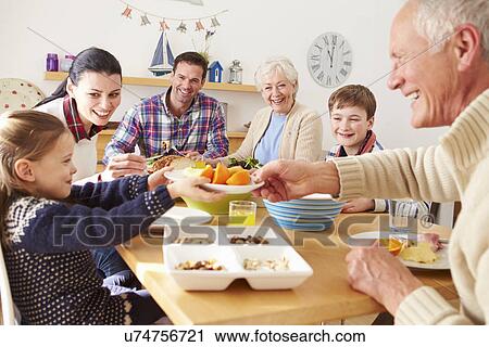 Multi Generation Family Eating Lunch At Kitchen Table View Large Photo Image Stock Image - Multi Generation Family Eating Lunch At Kitchen Table. Fotosearch