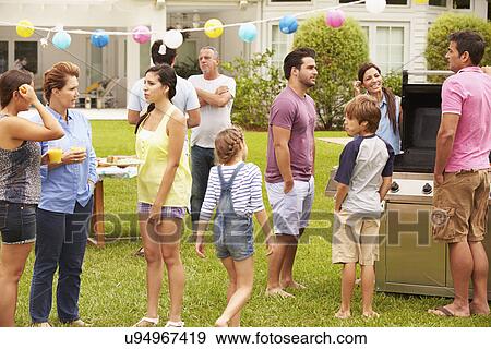Multi Generation Family Enjoying Party In Garden Together View Large Photo Image Stock Photo - Multi Generation Family Enjoying Party In Garden Together. Fotosearch