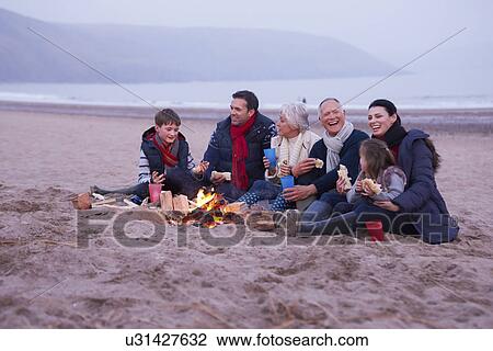 Multi Generation Family Having Barbeque On Winter Beach View Large Photo Image Stock Image - Multi Generation Family Having Barbeque On Winter Beach . Fotosearch