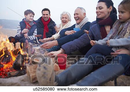 Multi Generation Family Having Barbeque On Winter Beach View Large Photo Image Stock Image - Multi Generation Family Having Barbeque On Winter Beach . Fotosearch