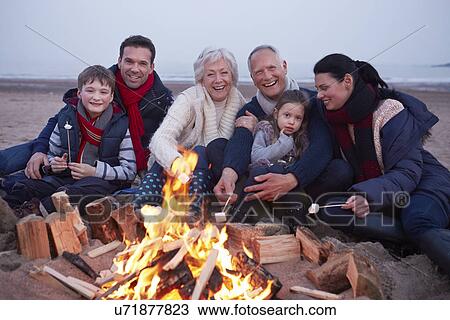 Multi Generation Family Having Barbeque On Winter Beach View Large Photo Image Stock Image - Multi Generation Family Having Barbeque On Winter Beach . Fotosearch