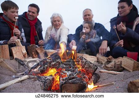 Multi Generation Family Having Barbeque On Winter Beach View Large Photo Image Stock Photography - Multi Generation Family Having Barbeque On Winter Beach . Fotosearch