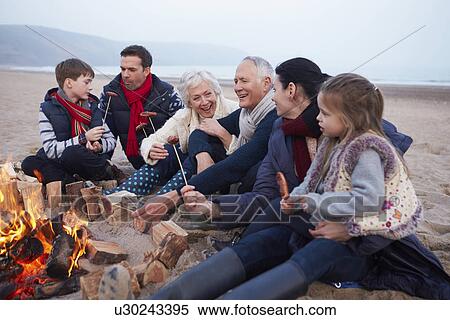 Multi Generation Family Having Barbeque On Winter Beach View Large Photo Image Stock Photography - Multi Generation Family Having Barbeque On Winter Beach . Fotosearch