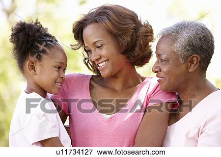 Stock Photo - Multi-generation family in park. Fotosearch