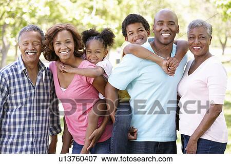 Multi-generation family in park View Large Photo Image Stock Photo - Multi-generation family in park. Fotosearch
