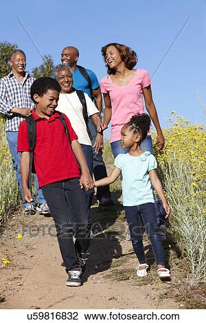 Stock Image - Multi-generation family on country hike. Fotosearch