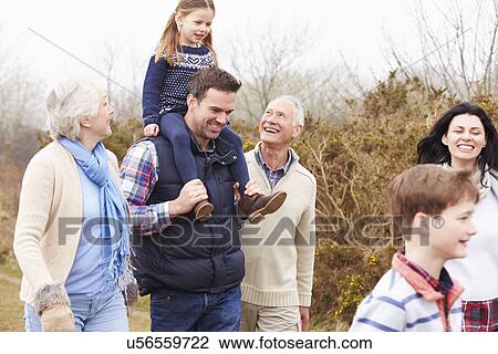 Stock Image - Multi Generation Family On Countryside Walk. Fotosearch