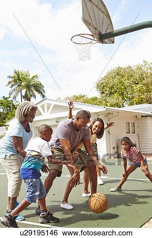 Multi Generation Family Playing Basketball Together View Large Photo Image Stock Photograph - Multi Generation Family Playing Basketball Together. Fotosearch