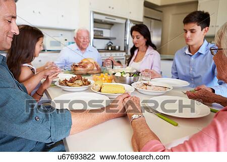 Multi-Generation Family Saying Prayer Before Eating Meal View Large Photo Image Stock Image - Multi-Generation Family Saying Prayer Before Eating Meal. Fotosearch