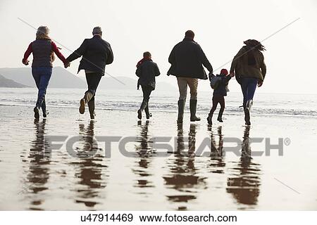Multi Generation Family Walking On Winter Beach View Large Photo Image Stock Photo - Multi Generation Family Walking On Winter Beach . Fotosearch