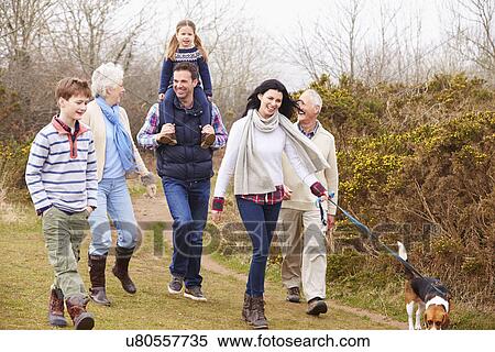 Stock Photography - Multi Generation Family With Dog On Countryside Walk. Fotosearch