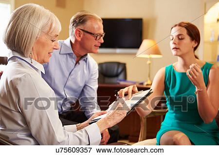 Older Couple Talking To Financial Advisor In Office View Large Photo Image Stock Photo - Older Couple Talking To Financial Advisor In Office. Fotosearch