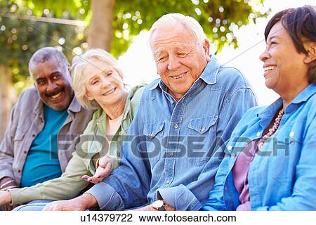 Stock Image - Outdoor Group Portrait Of Senior Friends. Fotosearch
