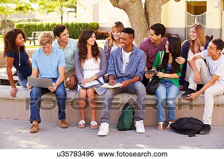 Stock Photograph - Outdoor Portrait Of High School Students On Campus. Fotosearch