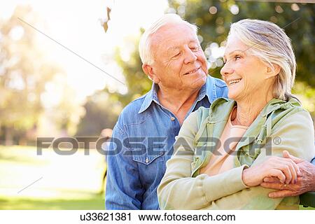 Stock Image - Outdoor Portrait Of Loving Senior Couple. Fotosearch