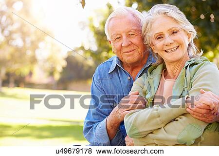 Stock Photo - Outdoor Portrait Of Loving Senior Couple. Fotosearch