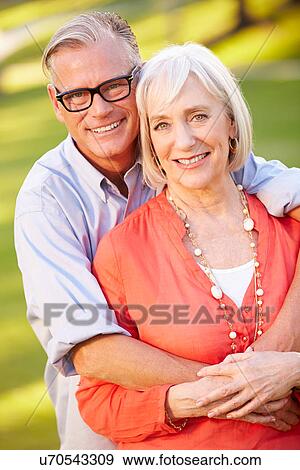 Stock Photo - Outdoor Portrait Of Mature Romantic Couple. Fotosearch