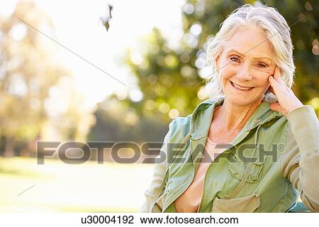 Outdoor Portrait Of Smiling Senior Woman View Large Photo Image Stock Image - Outdoor Portrait Of Smiling Senior Woman. Fotosearch