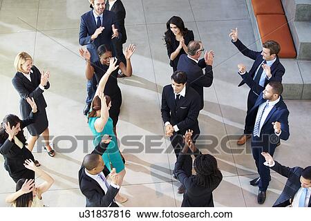 Overhead View Of Businesspeople Dancing In Office Lobby View Large Photo Image Stock Photograph - Overhead View Of Businesspeople Dancing In Office Lobby. Fotosearch