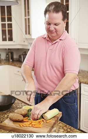 Overweight Man Preparing Vegetables in Kitchen View Large Photo Image Stock Image - Overweight Man Preparing Vegetables in Kitchen. Fotosearch