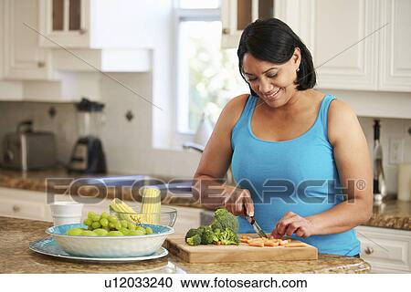 Overweight Woman Preparing Vegetables In Kitchen View Large Photo Image Stock Image - Overweight Woman Preparing Vegetables In Kitchen. Fotosearch