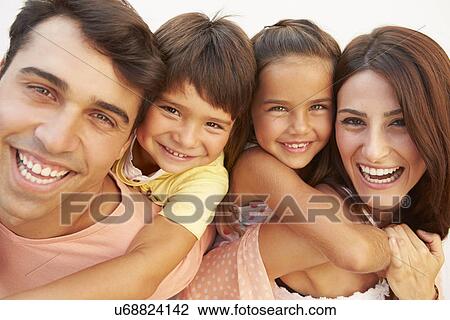 Parents Giving Children Piggyback Ride In Garden View Large Photo Image Stock Image - Parents Giving Children Piggyback Ride In Garden . Fotosearch