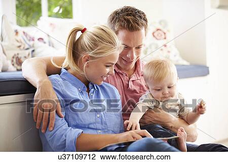 Parents Reading Book To Young Son View Large Photo Image Stock Image - Parents Reading Book To Young Son. Fotosearch
