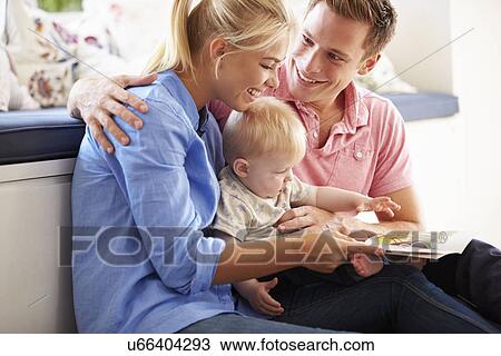 Parents Reading Book To Young Son View Large Photo Image Stock Image - Parents Reading Book To Young Son. Fotosearch