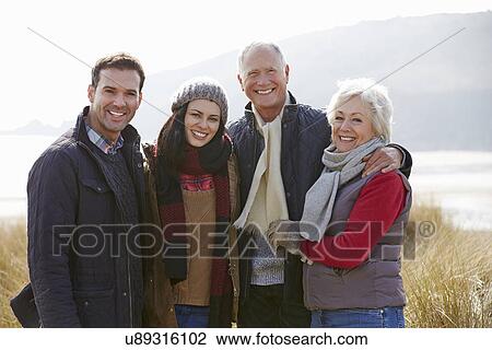 Parents With Adult Offspring Standing In Dunes View Large Photo Image Stock Image - Parents With Adult Offspring Standing In Dunes. Fotosearch
