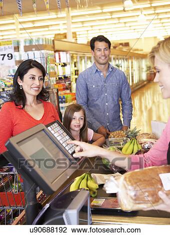 People at supermarket checkout View Large Photo Image Stock Image - People at supermarket checkout. Fotosearch