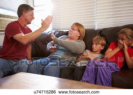Physically Abusive Father With Family On Sofa View Large Photo Image Stock Photograph - Physically Abusive Father With Family On Sofa. Fotosearch