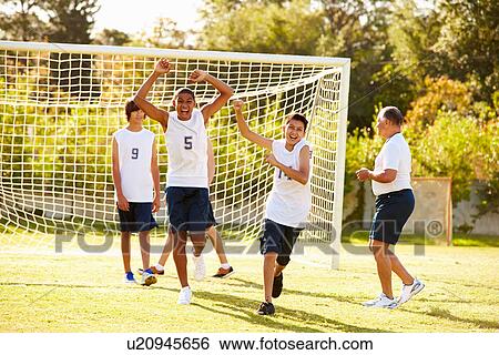 Player Scoring Goal In High School Soccer Match View Large Photo Image Stock Photograph - Player Scoring Goal In High School Soccer Match. Fotosearch
