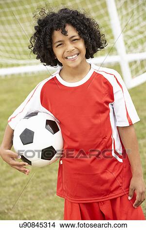 Portrait boy in football kit with ball View Large Photo Image Picture - Portrait boy in football kit with ball. Fotosearch