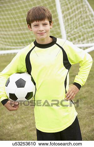 Portrait boy in goalkeeper's kit with ball View Large Photo Image Stock Image - Portrait boy in goalkeeper's kit with ball. Fotosearch