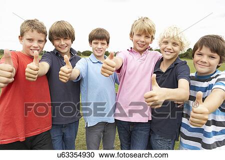 Portrait group of boys doing thumbs up in park View Large Photo Image Stock Image - Portrait group of boys doing thumbs up in park. Fotosearch