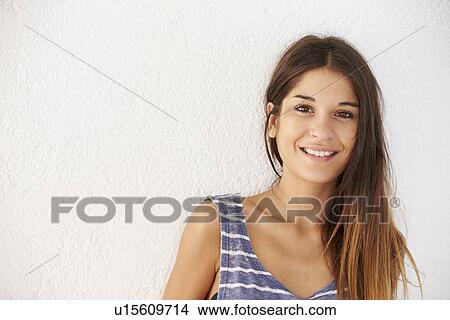 Portrait Of Casually Dressed Woman Leaning Against Wall View Large Photo Image Picture - Portrait Of Casually Dressed Woman Leaning Against Wall. Fotosearch