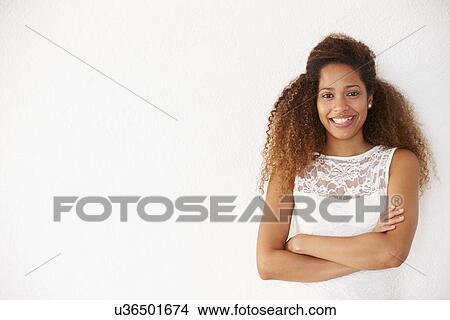 Portrait Of Casually Dressed Woman Leaning Against Wall View Large Photo Image Picture - Portrait Of Casually Dressed Woman Leaning Against Wall. Fotosearch