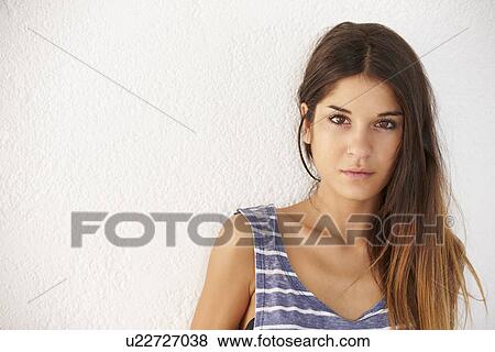 Portrait Of Casually Dressed Woman Leaning Against Wall View Large Photo Image Stock Photo - Portrait Of Casually Dressed Woman Leaning Against Wall. Fotosearch