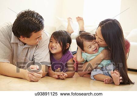 Portrait Of Family Lying On Floor At Home View Large Photo Image Stock Photography - Portrait Of Family Lying On Floor At Home. Fotosearch