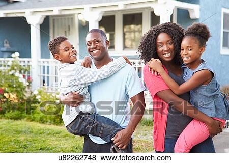 Portrait Of Family Outside Suburban Home View Large Photo Image Stock Photo - Portrait Of Family Outside Suburban Home. Fotosearch