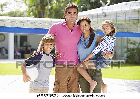 Portrait Of Family Playing Volleyball In Garden At Home View Large Photo Image Stock Image - Portrait Of Family Playing Volleyball In Garden At Home. Fotosearch