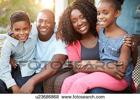 Portrait Of Family Sitting Outside House View Large Photo Image Stock Photo - Portrait Of Family Sitting Outside House. Fotosearch