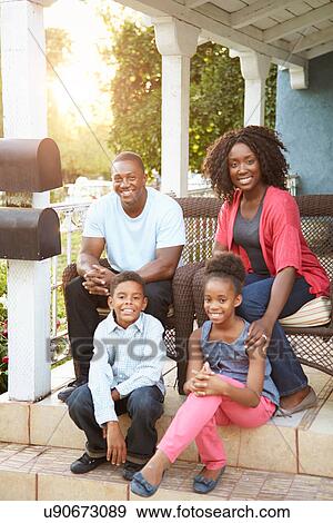 Portrait Of Family Sitting Outside House View Large Photo Image Stock Photo - Portrait Of Family Sitting Outside House. Fotosearch