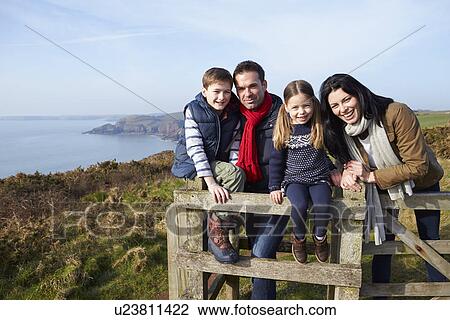 Portrait Of Family Walking Along Coastal Path View Large Photo Image Stock Image - Portrait Of Family Walking Along Coastal Path. Fotosearch