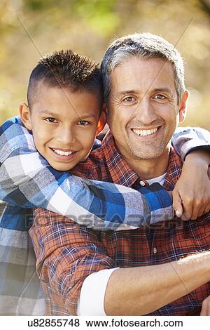 Portrait Of Father And Son In Countryside View Large Photo Image Stock Photo - Portrait Of Father And Son In Countryside. Fotosearch