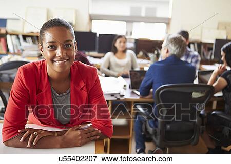 Portrait Of Female Architect With Meeting In Background View Large Photo Image Stock Photo - Portrait Of Female Architect With Meeting In Background. Fotosearch