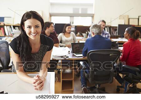 Portrait Of Female Architect With Meeting In Background View Large Photo Image Stock Photo - Portrait Of Female Architect With Meeting In Background. Fotosearch